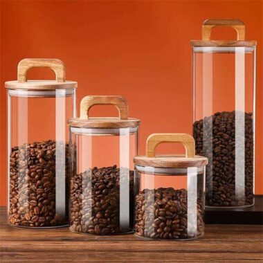 Transparent glass storage jars with sealed wooden lids
