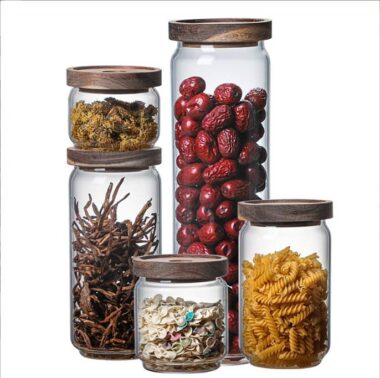 Transparent glass storage jar with acacia