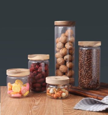 Transparent glass storage jar with acacia