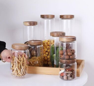 Transparent glass storage jar with acacia