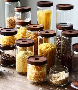 Transparent glass storage jar with acacia