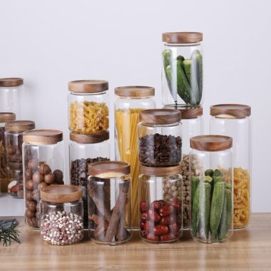 Transparent glass storage jar with acacia