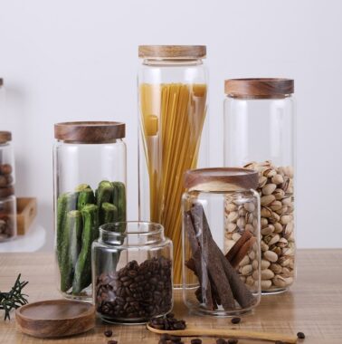 Transparent glass storage jar with acacia